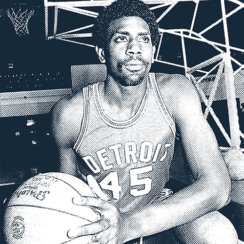 Spencer Haywood in Pistons uniform holding a basketball